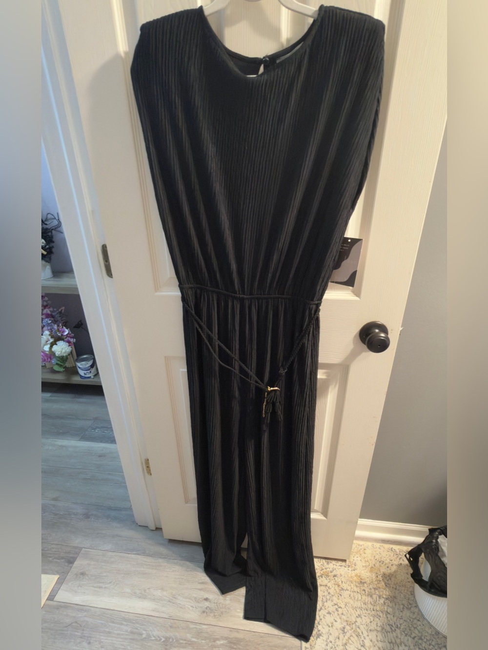 NWOT Women’s Black textured Jumpsuit with Waist Tie and padded shoulders